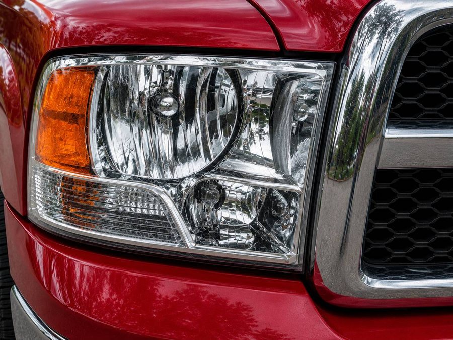 The same Ram 1500 headlight after restoration, clear enough to see the reflector